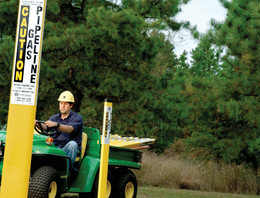 man riding green gator